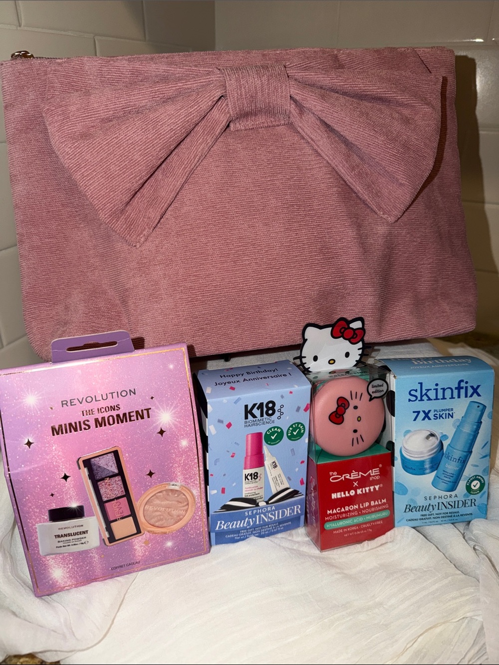 Assorted Beauty Boxed Sets (4) Enclosed in a pink corduroy, cosmetic pouch NWT